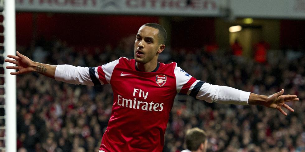 Arsenal&#39;s Theo Walcott celebrates after scoring the opening goal against Newcastle United during their English Premier League soccer match at the Emirates stadium, London, Saturday, Dec. 29, 2012.